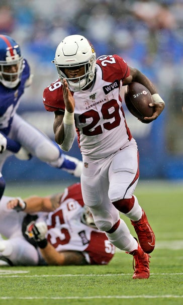 Edmonds runs for 3 TDs, Cards top Giants in Barkley's return